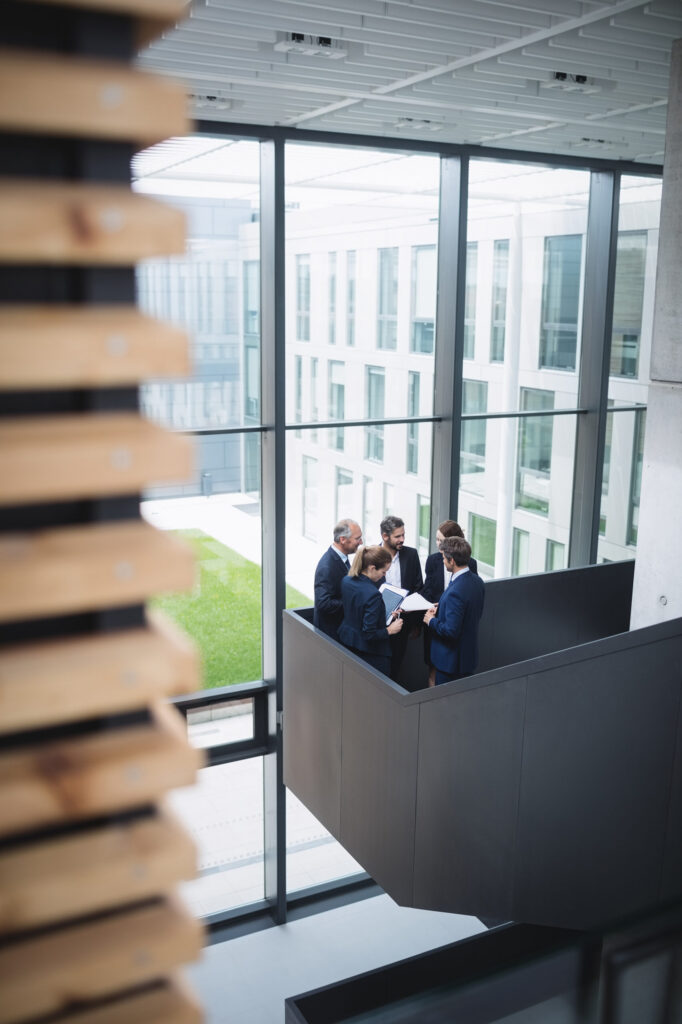 businesspeople-having-discussion-office-LR-scaled